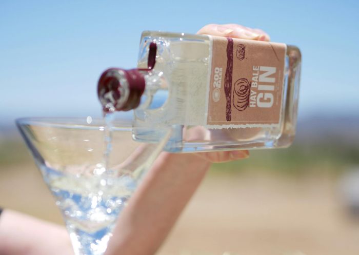 Baker Williams Hay Bale Gin being poured into a cocktail glass, Mudgee - Credit: Rob Jeeves - Razorbyte Photography | Baker Williams Distillery