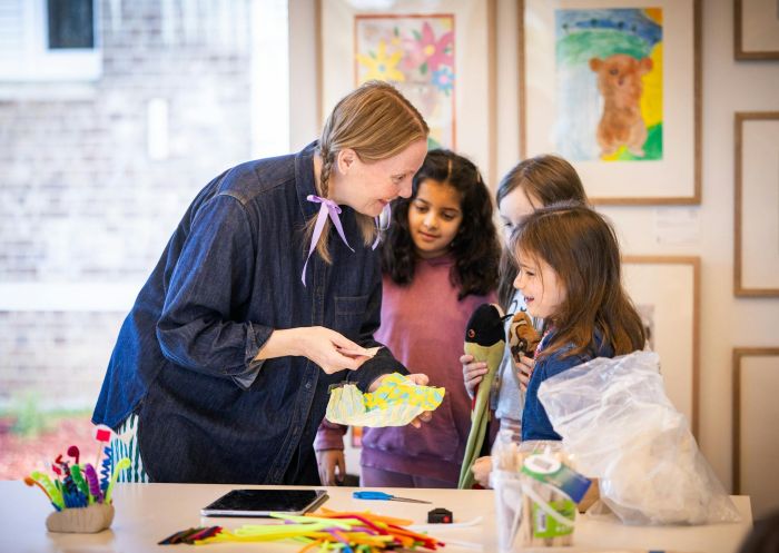 Woman talking to three children making arts and crafts at Ngununggula Southern Highlands Regional Gallery, Bowral - Credit: Brian Rapsey