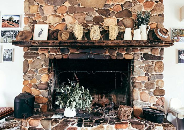 Old stone fireplace inside the family owned dairy business in Bodalla - Credit: Bodalla Dairy Shed