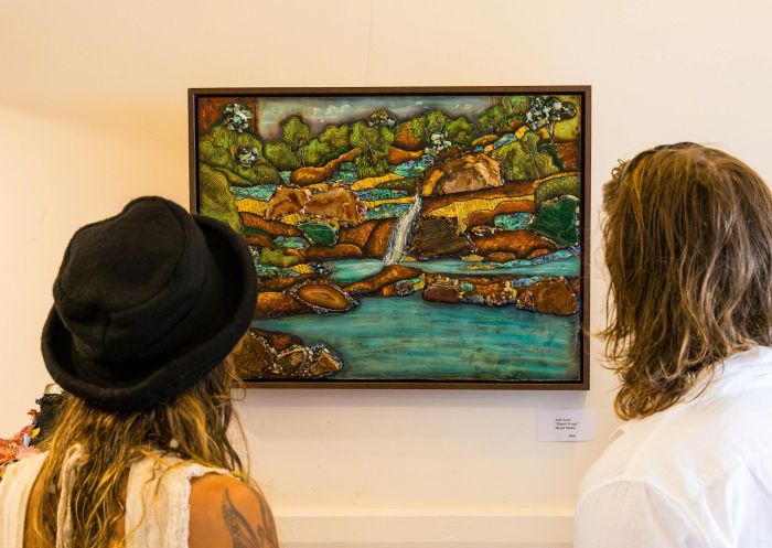 Couple admiring artwork, Nimbin Artists Gallery, Nimbin - Credit: Fables by Nikki J | Lismore City Council