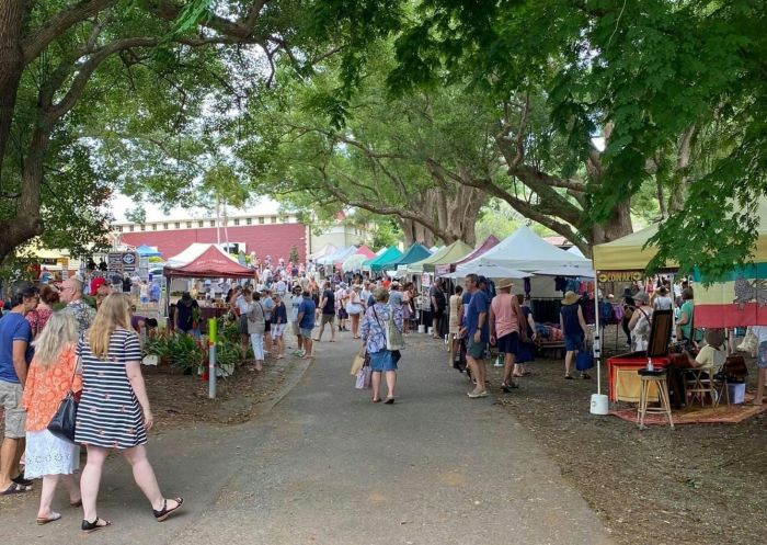 People looking at stalls under trees, Bangalow Market, Bangalow - Credit: Bangalow Market