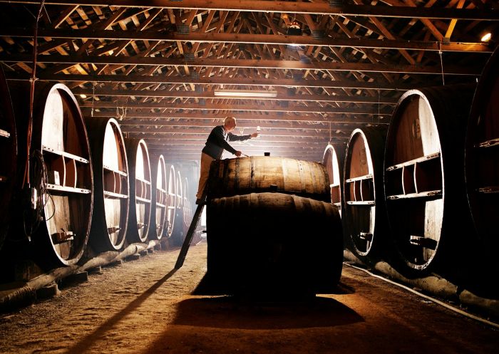 Pieter above a large barrel testing his wine his wine at Pieter van Gent Winery and Vineyard, Eurunderee - Credit: Pieter van Gent Winery & Vineyard