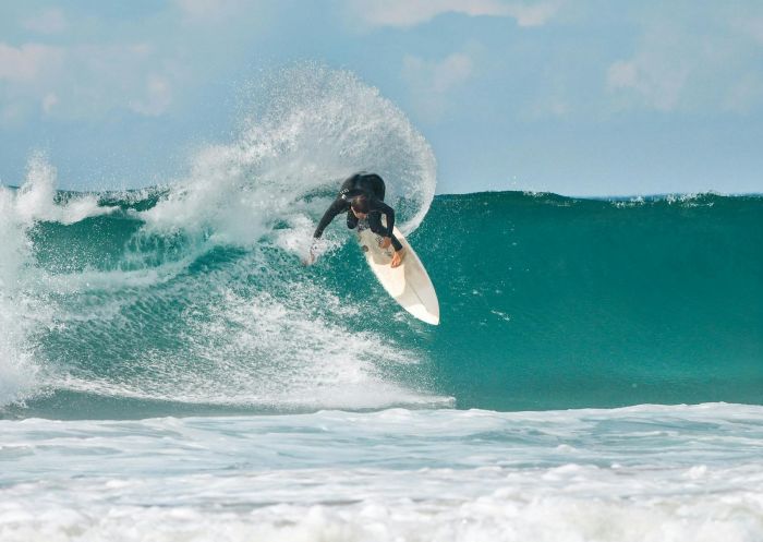 Surfer riding a wave, Lennox Head Beach, Lennox Head - Credit: Lennox Head Beach
