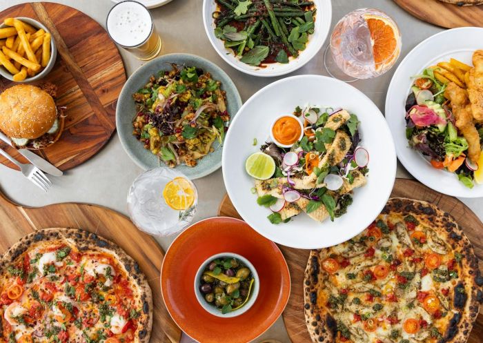 An appetizing spread of pizza, burgers and other dishes at Foxdog Distillery, Mogo - Credit: Taylah Cunningham | Foxdog Distillery