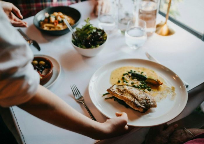 A waitress serving dinner at Bistro Sociale within Berida Hotel, Bowral - Credit: Berida Hotel