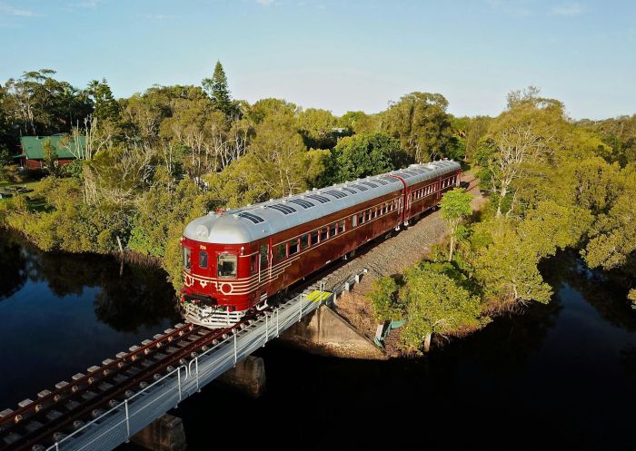  Train on tracks driving through nature, Byron Solar Train, Byron Bay - Credit: Byron Bay Railroad Company Pty Ltd