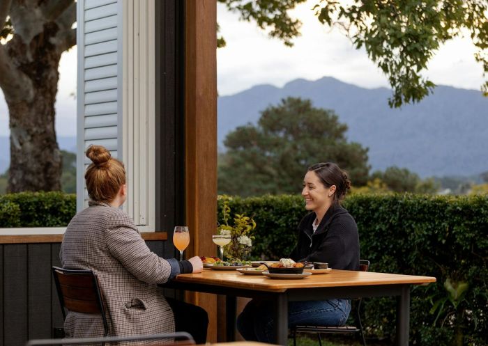 Couple eating on balcony, Three Blue Ducks Bellingen, Bellingen - Credit: Three Blue Ducks 