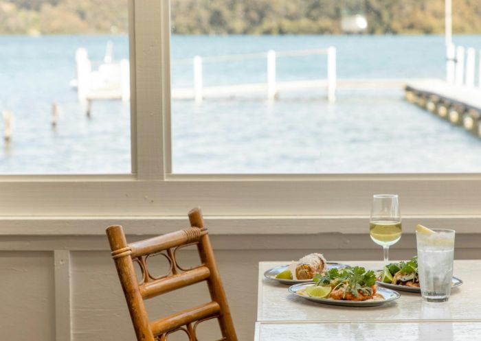 A table with starters near a window with water views at The Quarterdeck Narooma, Narooma - Credit: Honey Atkinson | Honey Atkinson