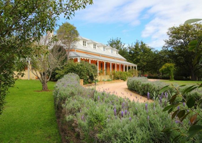 Front view of Fitzroy Inn with the building and heather lined driveway in Mittagong - Credit: The Fitzroy Inn