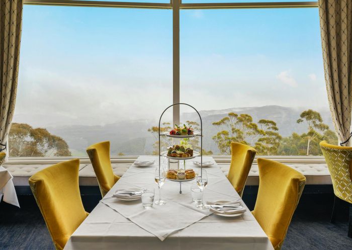 Table with high tea next to a window looking out to the country, Medlow Bath - Credit: Salter Brothers Hospitality