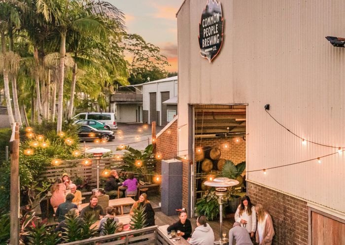 Common People deck with patrons enjoying beer and pizza, Common People Brewing Co., Bangalow - Credit: Common People Brewing Co