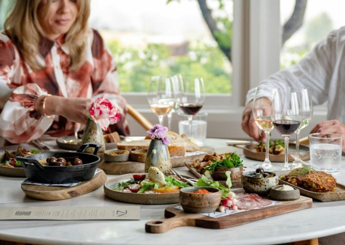 People enjoying a beautifully laid out grazing platter at Zin Food and Wine House, Eurunderee - Credit: Monique Lovick