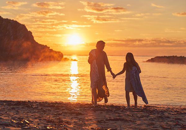 couple watching sunset at Guerilla Bay	