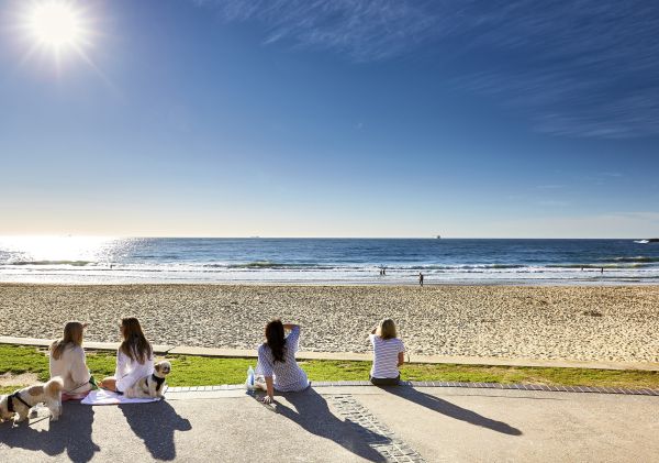 People relaxing at North Wollongong Beach in Wollongong