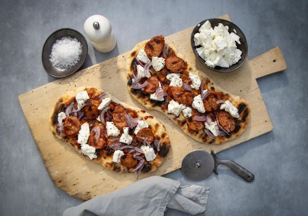 Buffalo mozzarella and traditional German sausage feature on this moreish flatbread pizza.