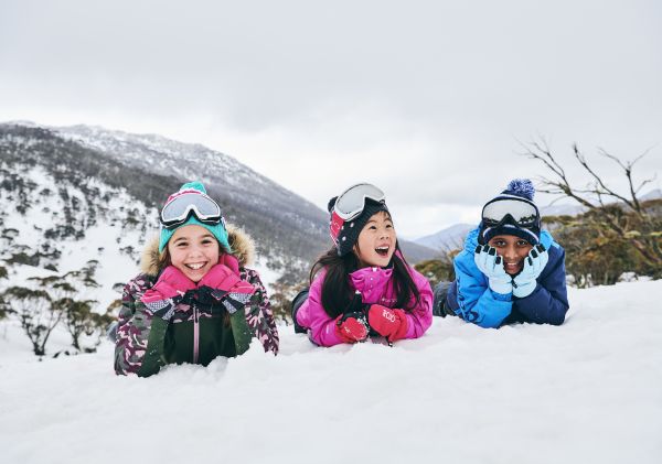 Children enjoying a fun day in the snow at Thredbo in the Snowy Mountains