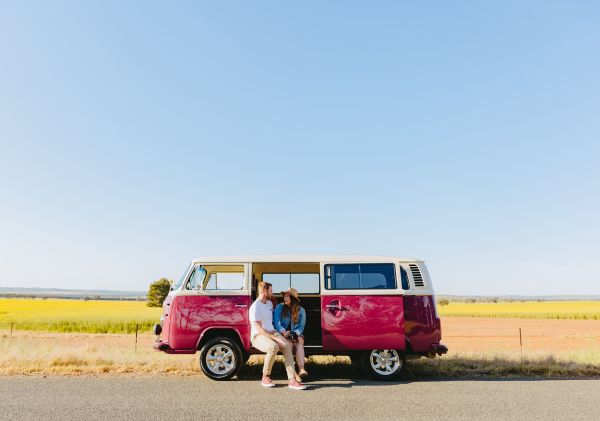 Couple parked by a canola field near Wagga Wagga