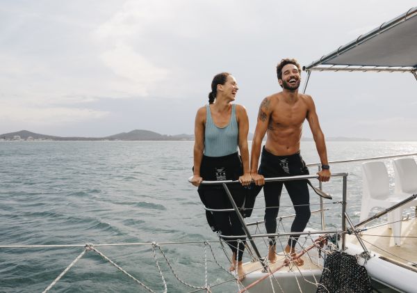 Couple enjoying a day out on the water with Dolphin Swim Australia, Port Stephens