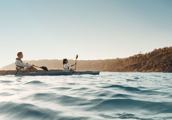Couple exploring the South Coast by kayak with Navigate Expeditions, Pambula