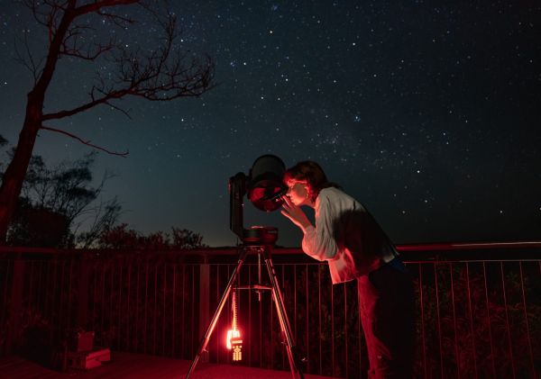 Women using telescope looking at the stars, Blue Mountains