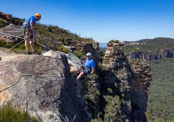 Woman abseiling at Cahills Lookout, Katoomba in the Blue Mountains