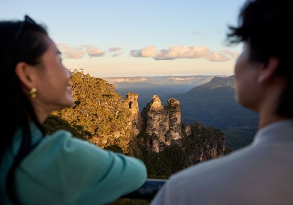 Couple visiting the Three Sisters, Echo Point, Katoomba