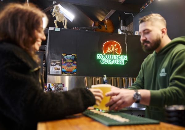 Man getting a beer, Katoomba Mountain Culture, Katoomba