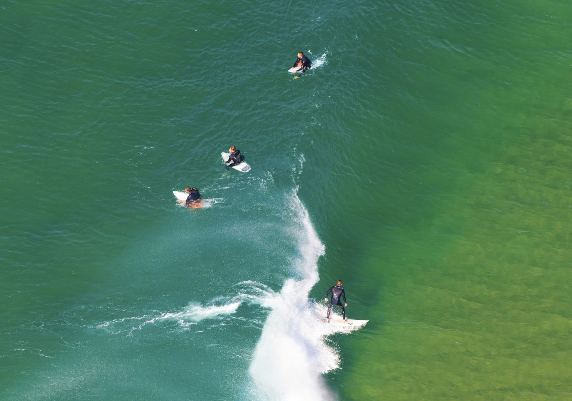 Surfers on North Avoca beach - Central Coast