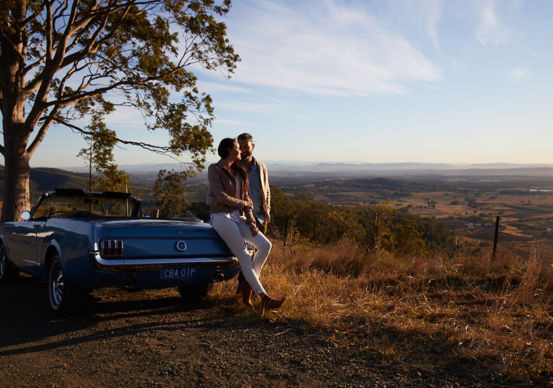 Couple pulled over to watch the sunrise in Pokolbin, Hunter Valley