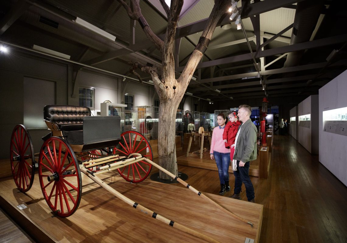 Family enjoying the "Peoples Places Possessions" permanent exhibition at the Western Plains Cultural Centre in Dubbo