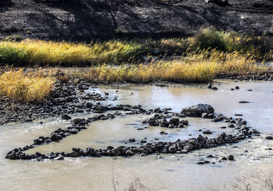 Stones in the Barwon River that form the ancient Aboriginal Brewarrina Fish Traps