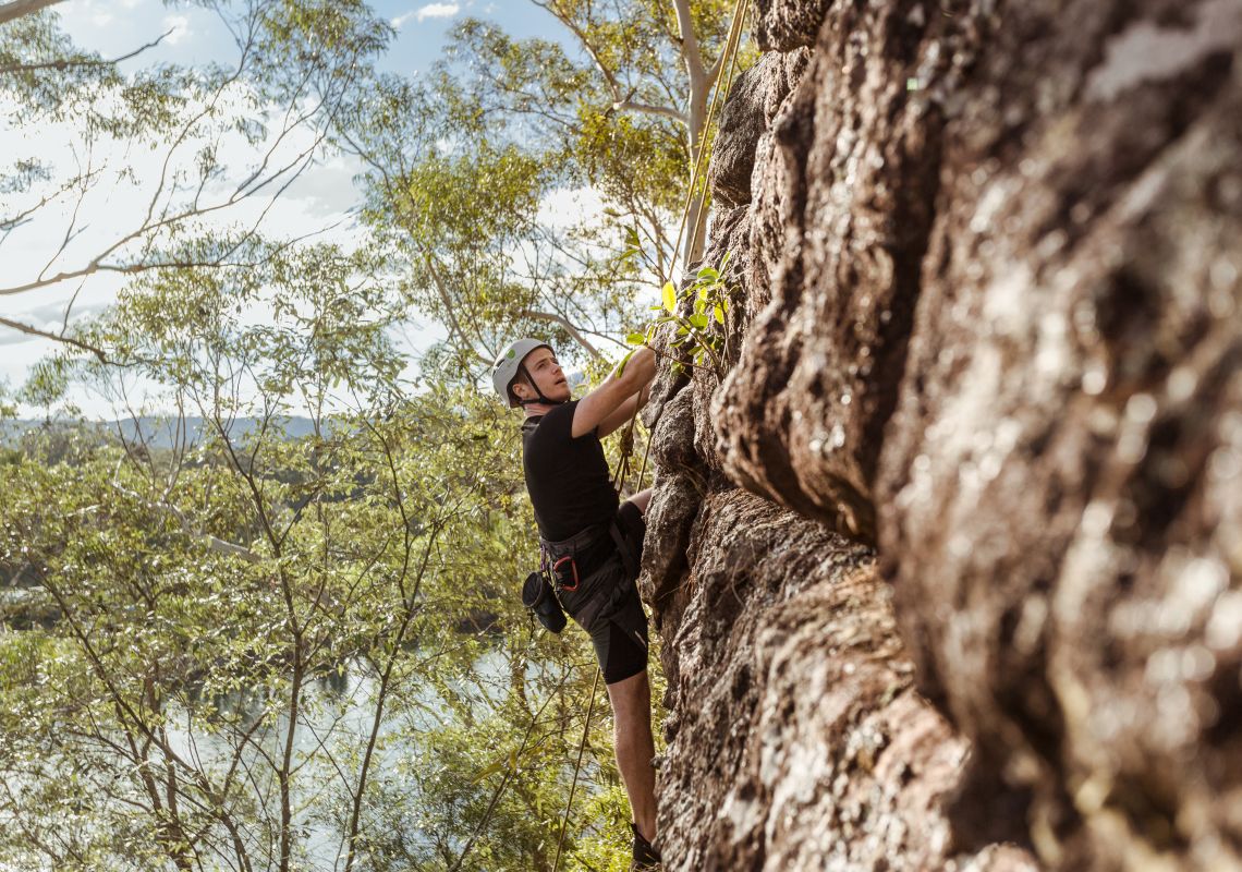 Man enjoying a rock climbing experience with Outdoor Raw in the Shoalhaven region of NSW