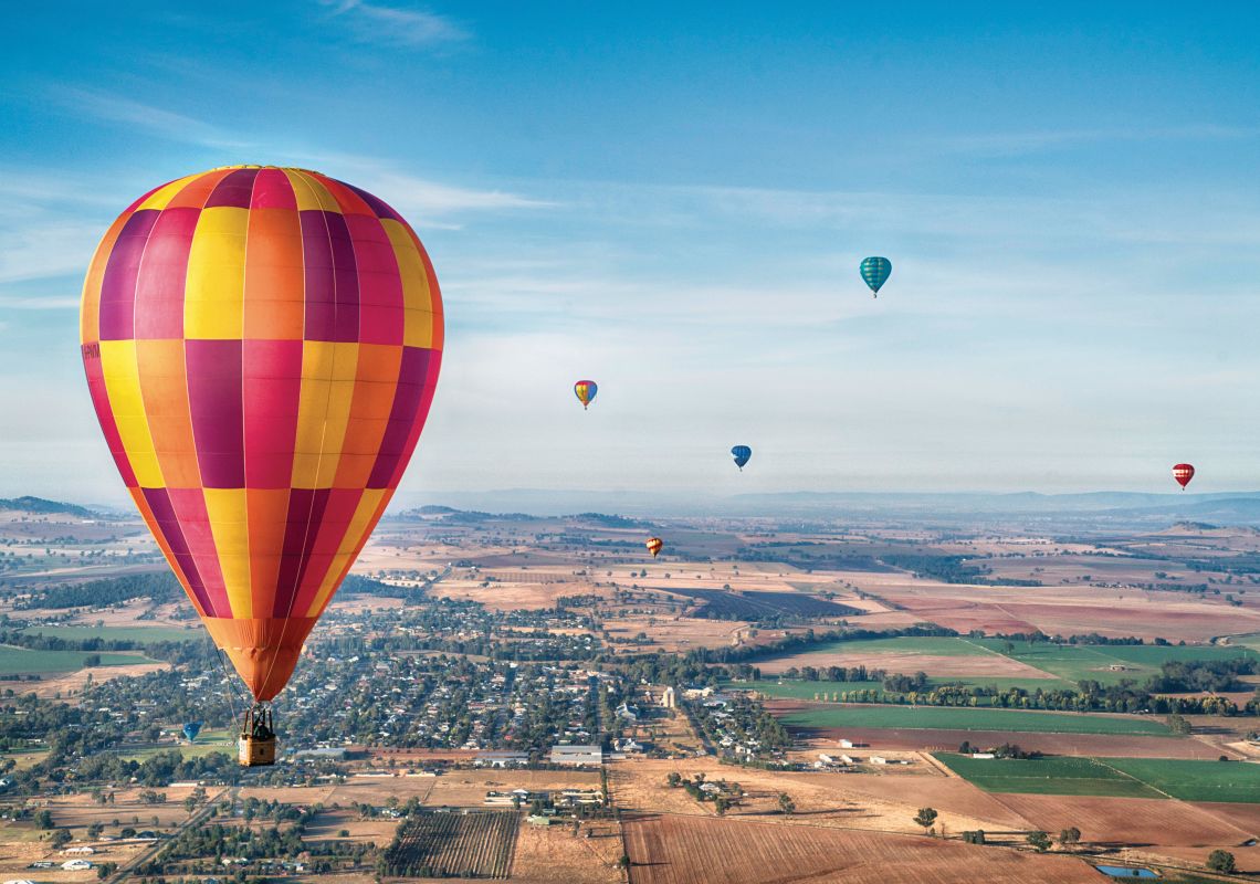 Hot air balloons flying over central NSW during the Canowindra International Balloon Challenge