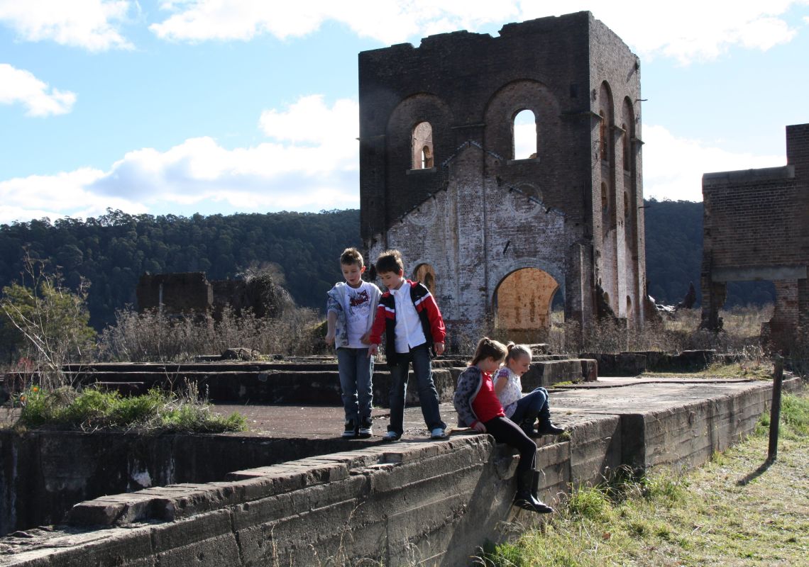 Children exploring the Blast Furnace Park, the remains of a pump house and furnace, Lithgow