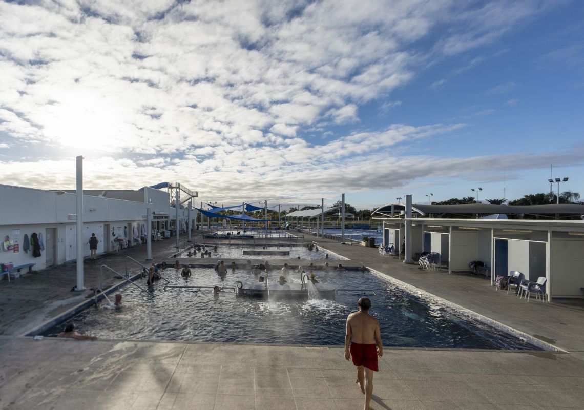 People enjoying a visit to the Moree Artesian Aquatic Centre in Moree, Country NSW