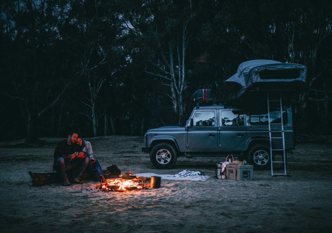A couple enjoying a camping weekend away on the banks of the Murray River at Ulupna Island - The Murray - Country NSW