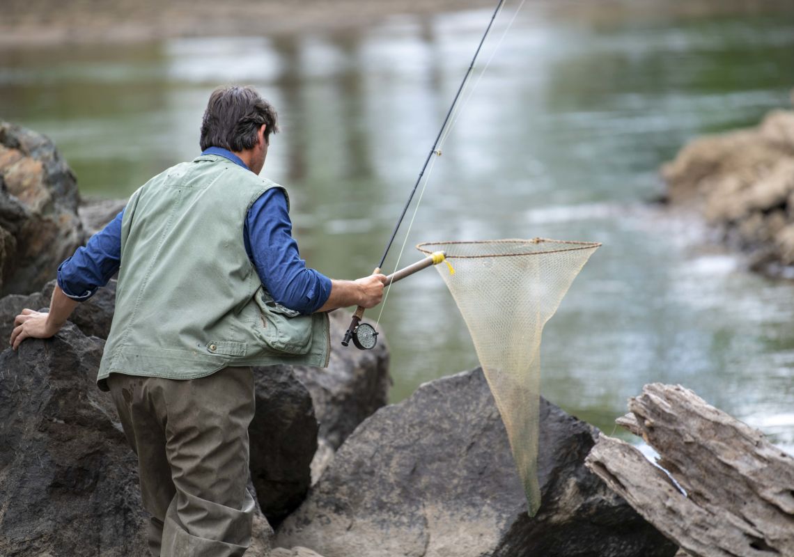 Man enjoying a day of fly fishing in Nimbo Creek, Killimicat