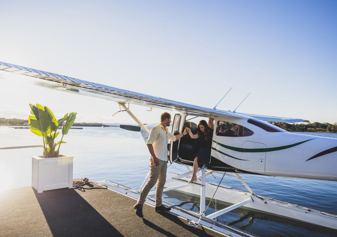 Guests arriving at Whalebone Wharf seafood restaurant by seaplane, Port Macquarie, North Coast