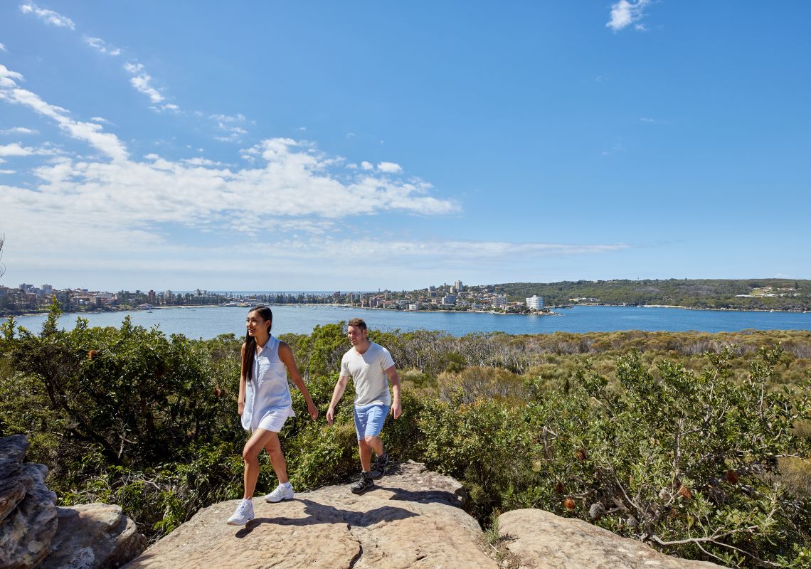 Couple enjoying stunning coastal views of Sydney Harbour from Dobroyd Head, Balgowlah Heights, Sydney