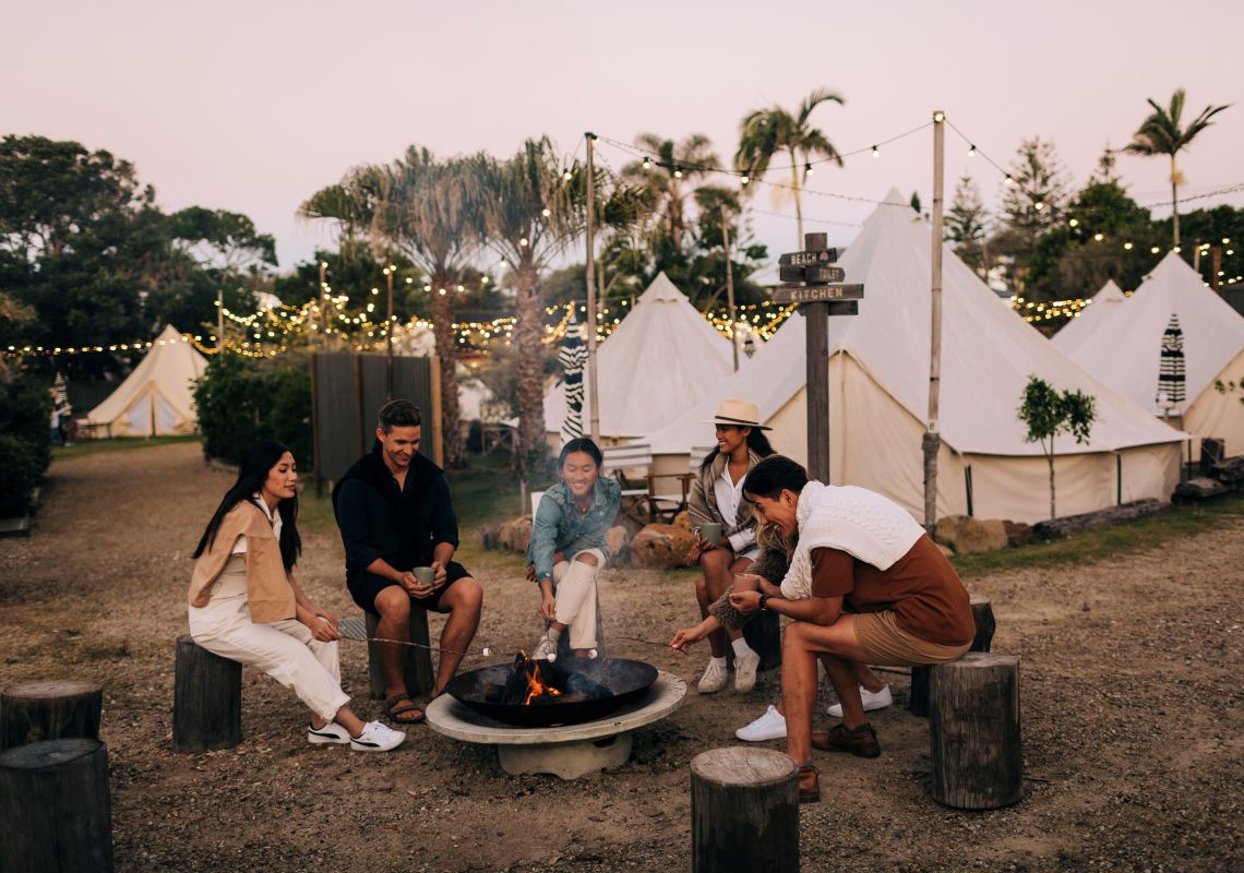 Friends roasting marshmallows and drinking hot chocolate by the pit fire at The Hideaway - Cabarita Beach - North Coast