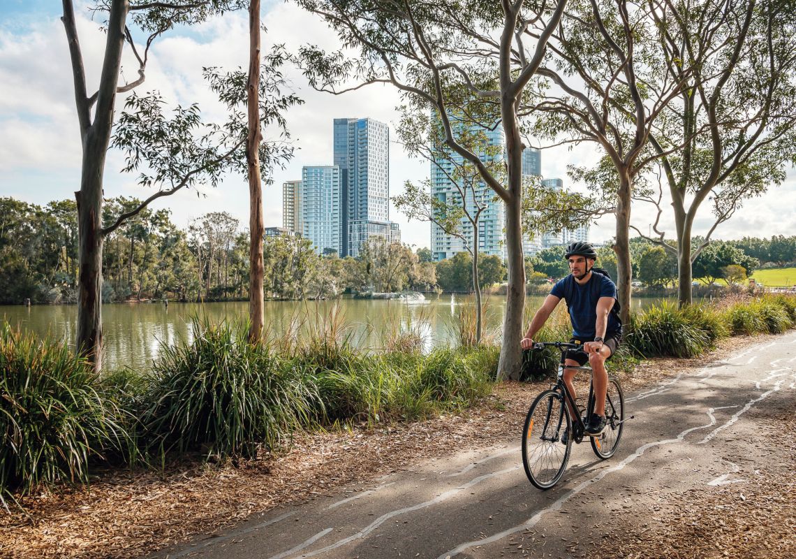 A cyclist riding on the bike trail in Bicentennial Park, Sydney Olympic Park