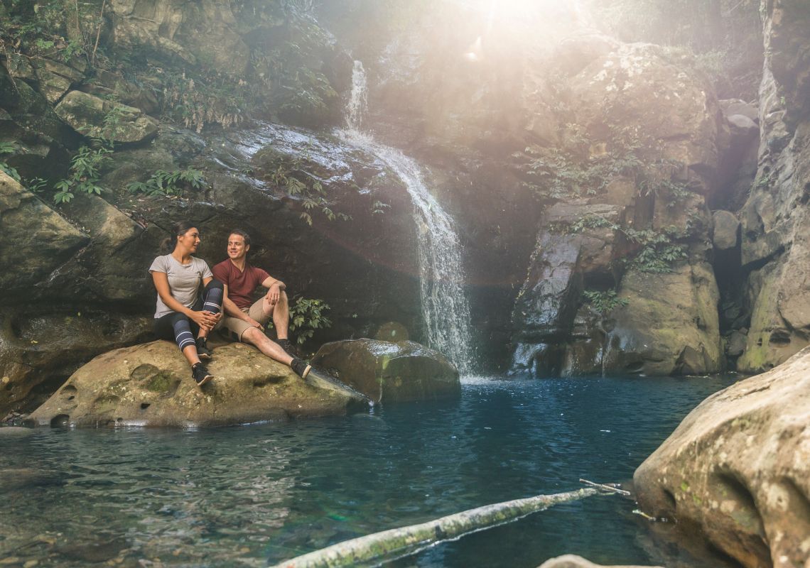 Couple enjoying a hike to Cascade Falls in Macquarie National Park, Shellharbour Area