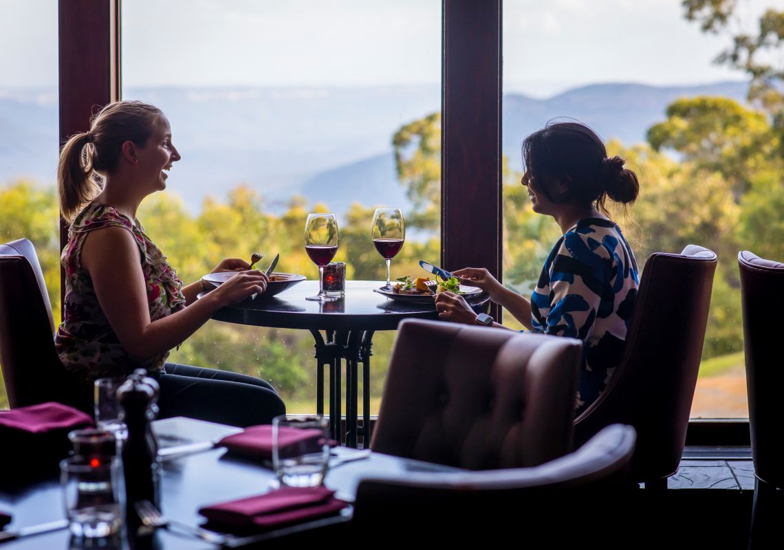 Women enjoying food and drink at Embers Restaurant inside the Fairmont Resort & Spa, Leura in the Blue Mountains