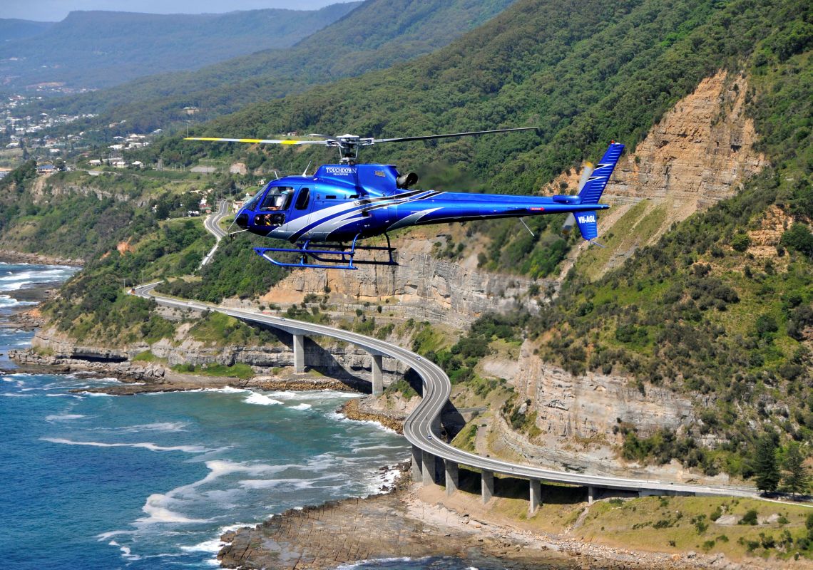 Touchdown Helicopters scenic flight passing the Sea Cliff Bridge, Clifton