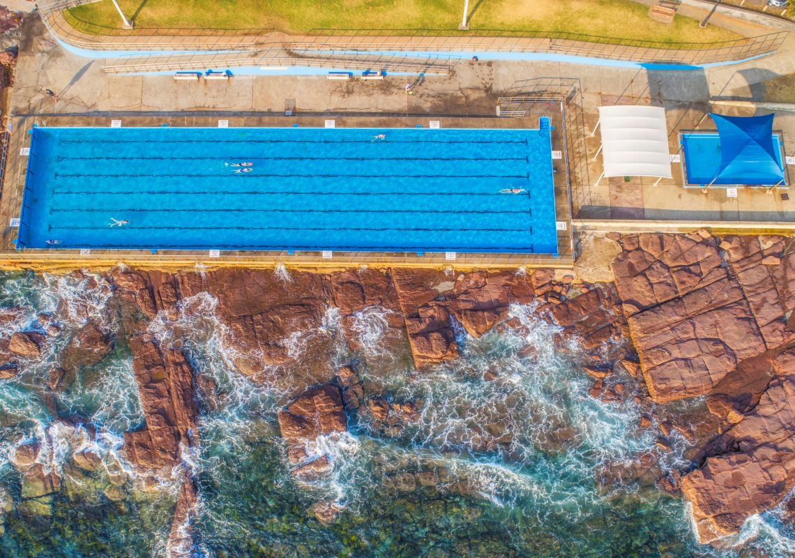 Aerial overlooking Shellharbour Swimming Pools in Shellharbour, South Coast