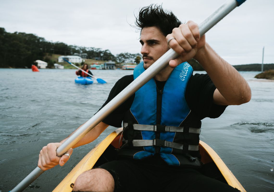 Man kayaking along Tuross Lake, Tuross Head