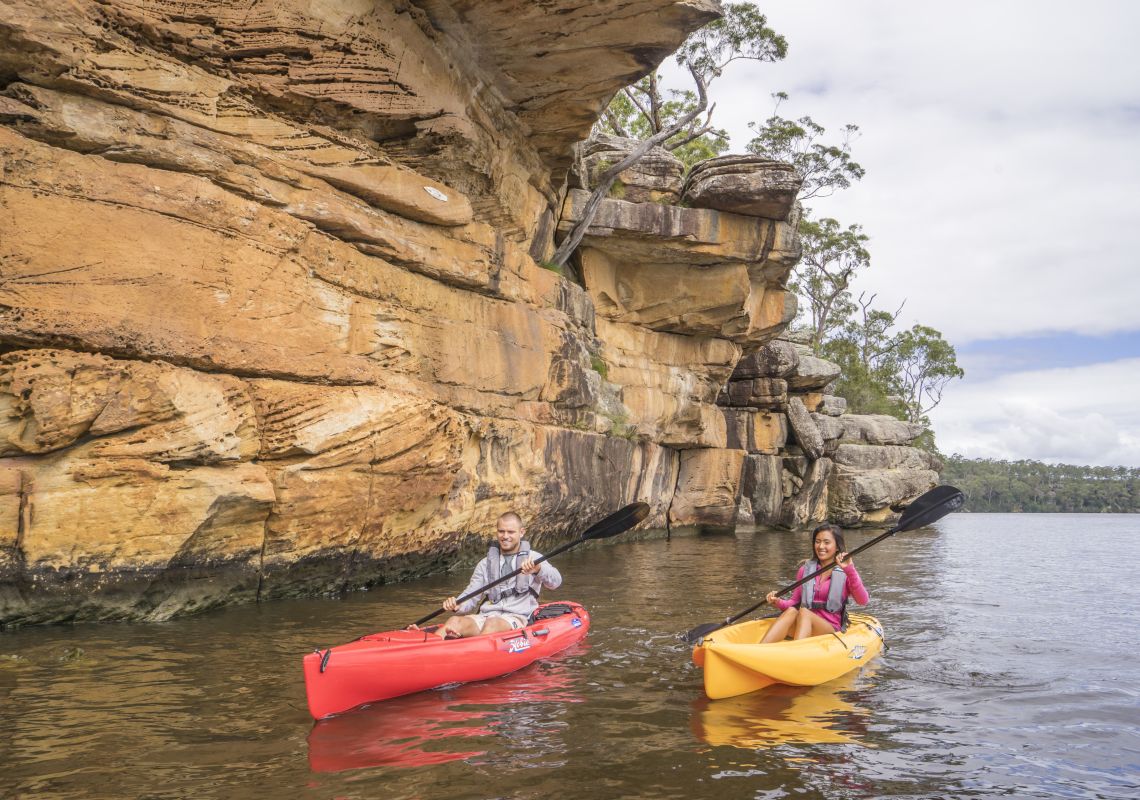 Couple enjoying a day of kayaking on the Shoalhaven River near Nowra, Jervis Bay and Shoalhaven