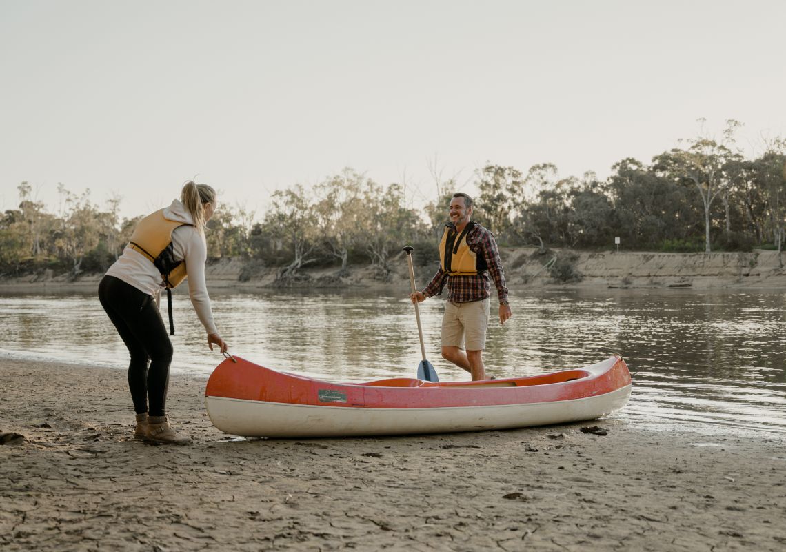 Couple enjoying a day of canoeing on the Murray River in Moama, The Murray