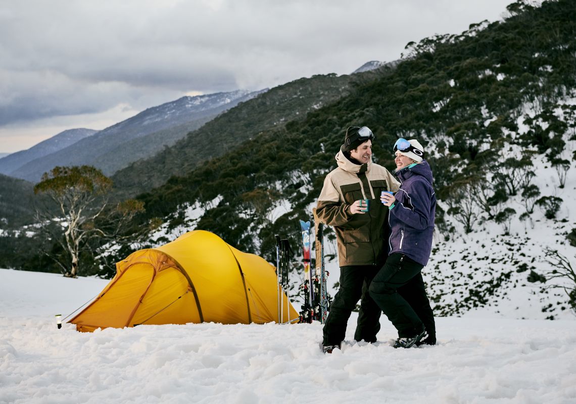 Couple relaxing by their tent in Dead Horse Gap, Thredbo in the Snowy Mountains