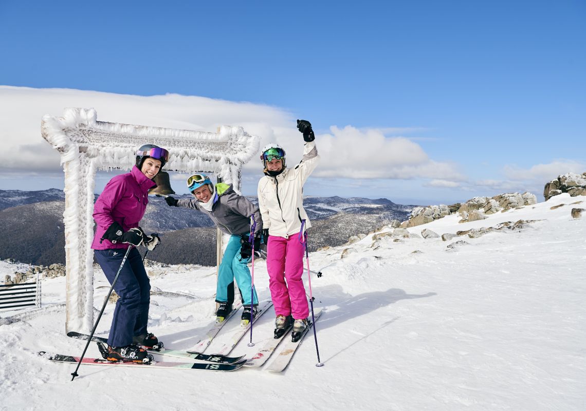 Skiers ringing the Thredbo Community Bell at Australia's Highest Lifted Point